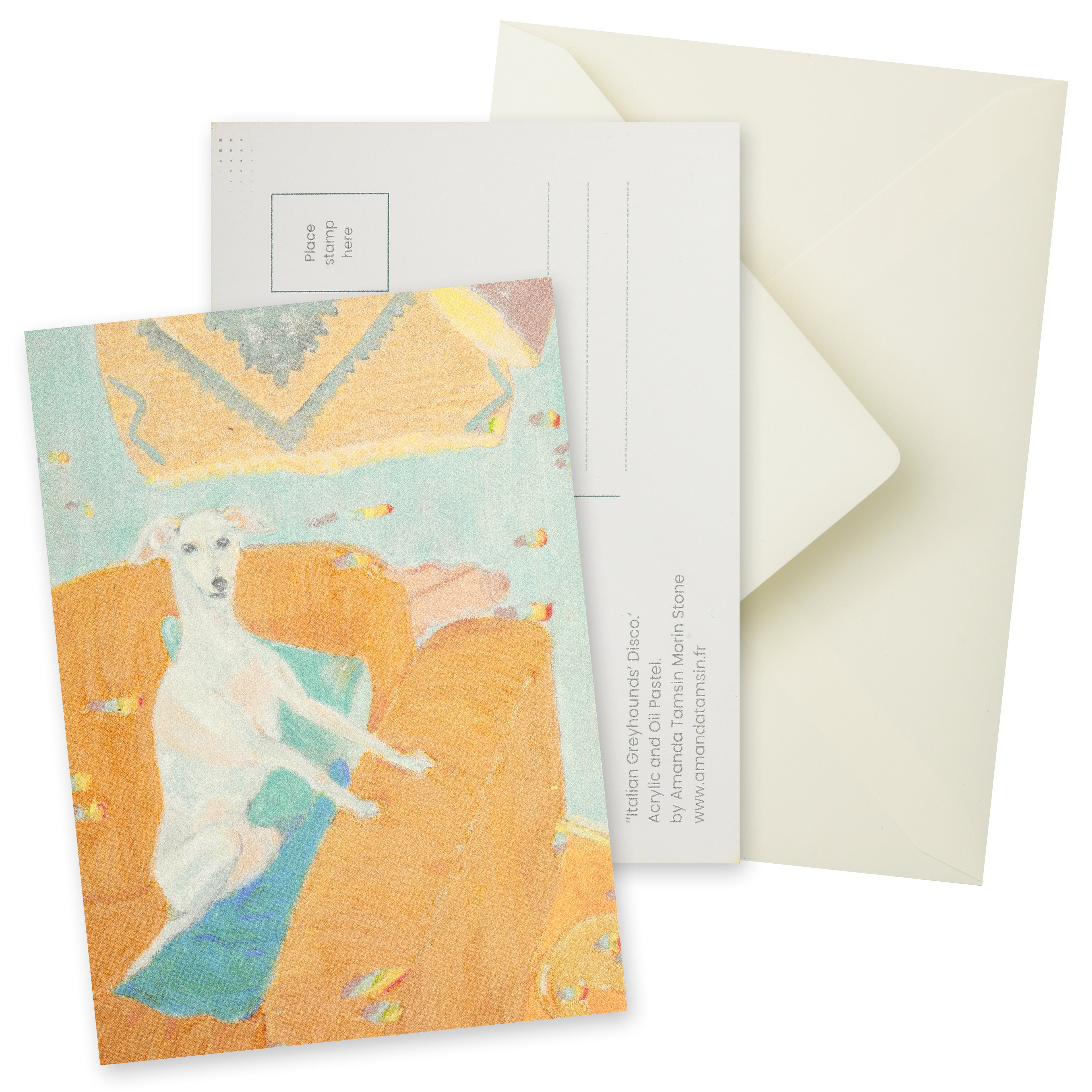 Postcard with a painting of a greyhound dog sitting in an orange-beige armchair with blue and green cushions.  Background (wall) is pale blue with a tapestry and mauve lamp.  Another dog is leaving the scene.  Includes the reverse of the postcard and a cream envelope.